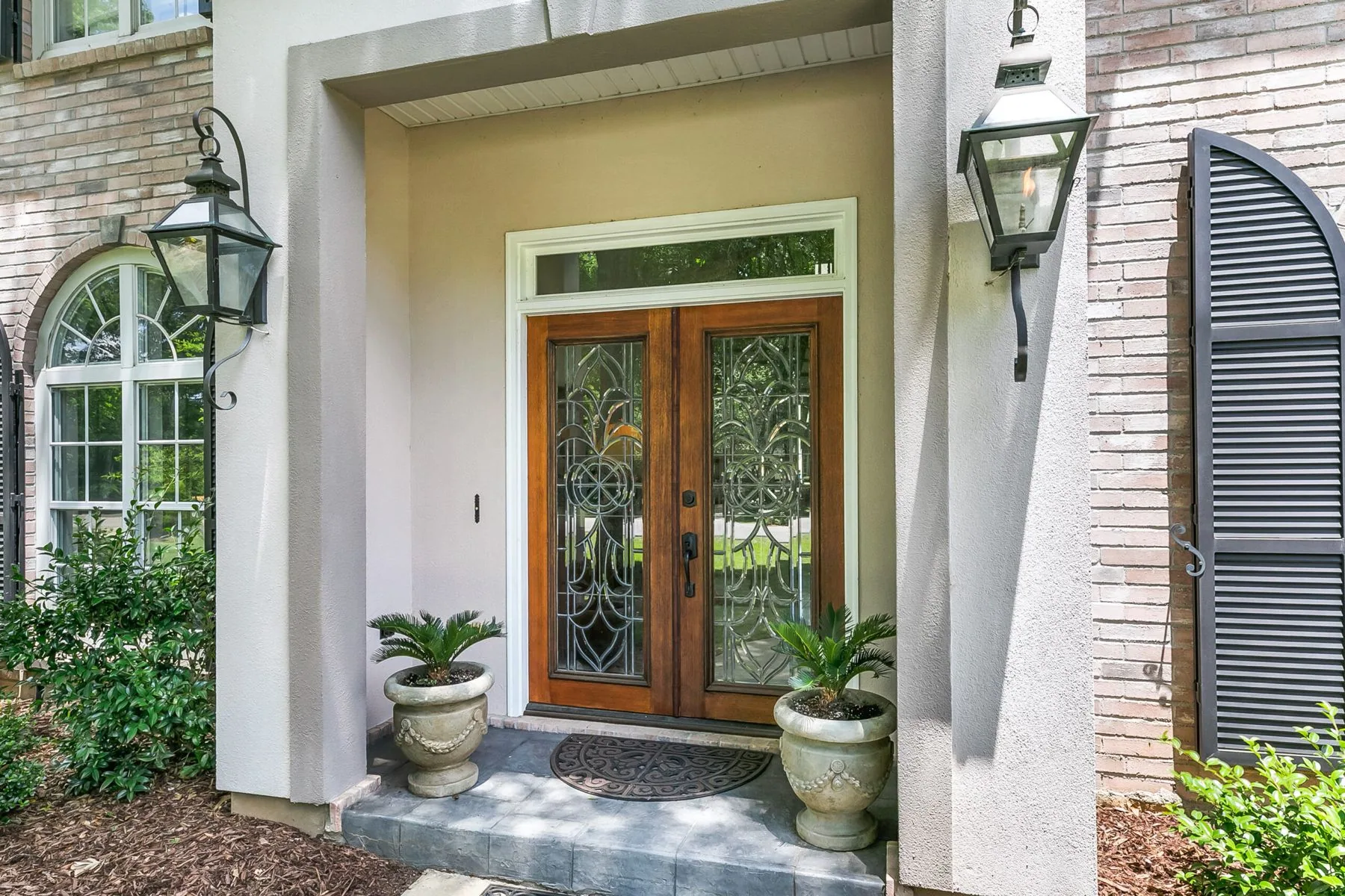 Mahogany double doors with leaded glass and transom