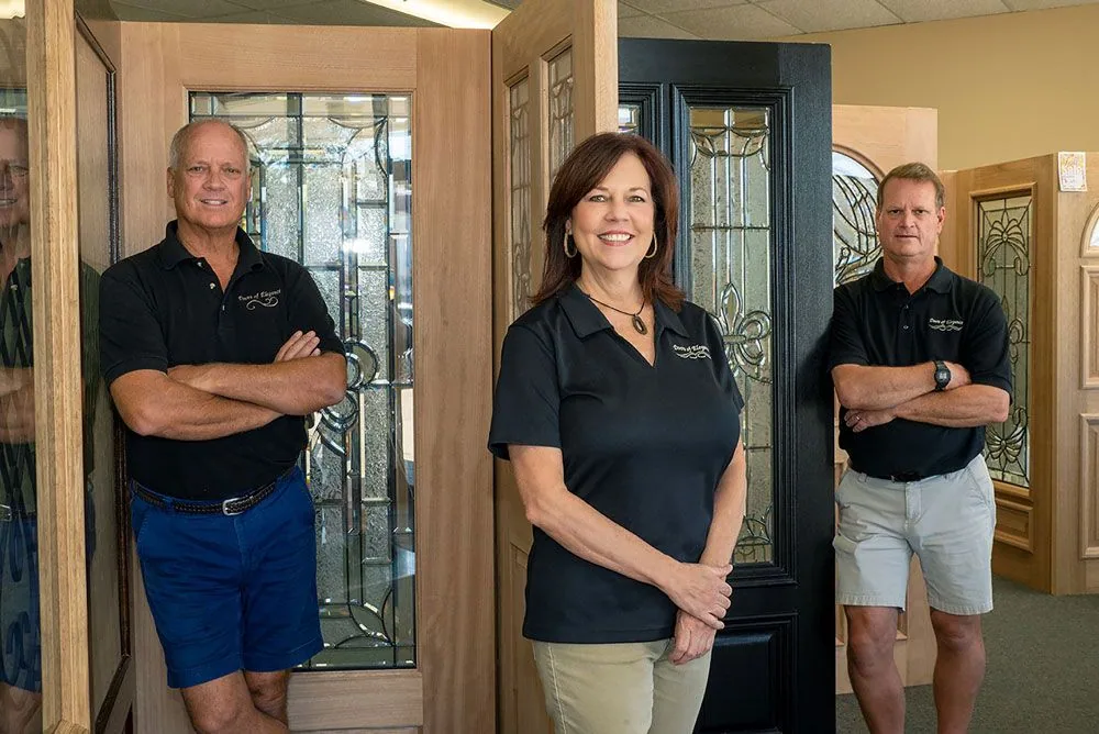 The Doors of Elegance family and team in the Metairie showroom