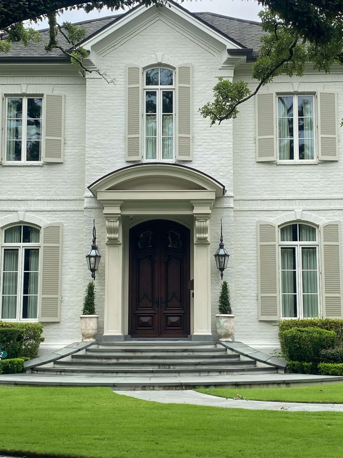 White brick home with new replacement windows